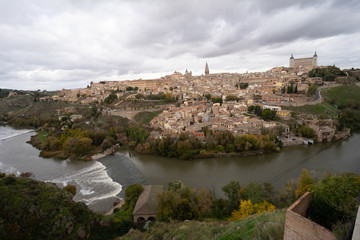 Fototapeta premium Skyline of old city of Toledo, Castile-La Mancha, Spain. View from the Ermita del Valle (Hermitage of Virgen del Valle) on the opposite bank of the river Tagus.