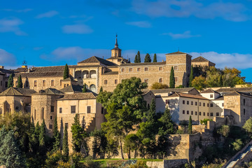 Fototapeta na wymiar Toledo Skyline with the museum of Santa Cruz in the background, a building of the 16th century of the city of Toledo, Spain. 