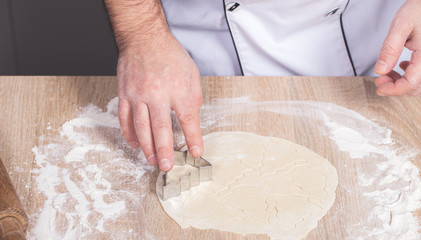 male cook preparing Christmas cookies