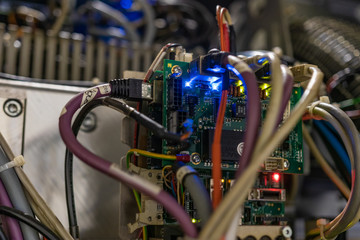 Mother board and core processors details, big data storage technology, cloud business and crypto currency concept. Microchips and small led lights indicate traffic volume and powering issues.