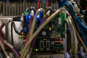 Mother board and core processors details, big data storage technology, cloud business and crypto currency concept. Microchips and small led lights indicate traffic volume and powering issues.