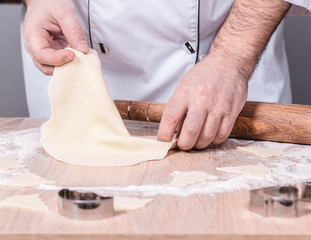 male cook preparing Christmas cookies