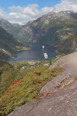 Fototapeta na wymiar View of mountains and fjord from observation deck. Geiranger, Norway