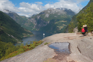 On observation deck, view of mountains and fjord. Geiranger, Norway