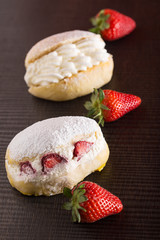 Sweet sandwich with cream and strawberries