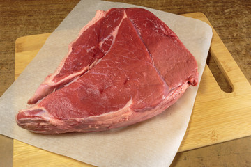 Fresh raw beef on a kitchen table.