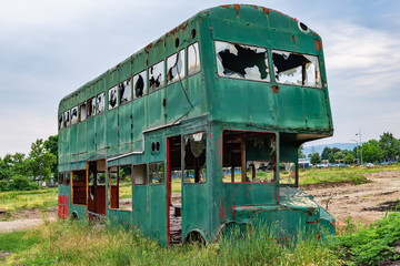 Novi Sad, Serbia May 26, 2018: Rusty Abandoned green Double-Decker Bus