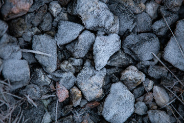 Ice and rocks on the beach. Frozen background