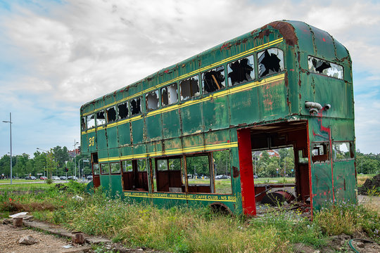 Novi Sad, Serbia May 26, 2018: Rusty Abandoned green Double-Decker Bus