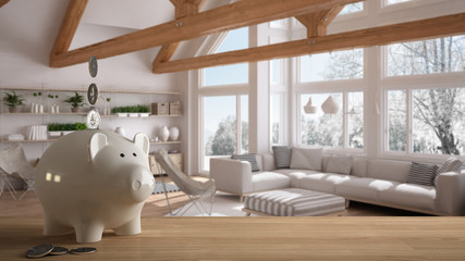 Wooden table top or shelf with white piggy bank with coins, classic living room with wooden trusses, expensive home interior design, renovation restructuring concept architecture