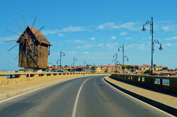 Fototapeta na wymiar welcome to Nessebar- old Bulgarian town, windmill and road view, travelling concept