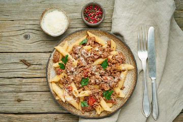 Bolognese pasta. Fusilli with tomato sauce, ground minced beef. Traditional italian cuisine. Top view.