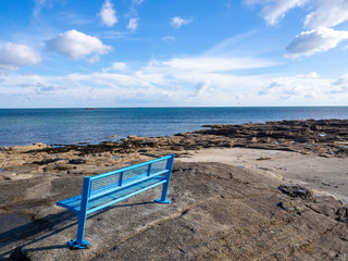 blue bench by the sea
