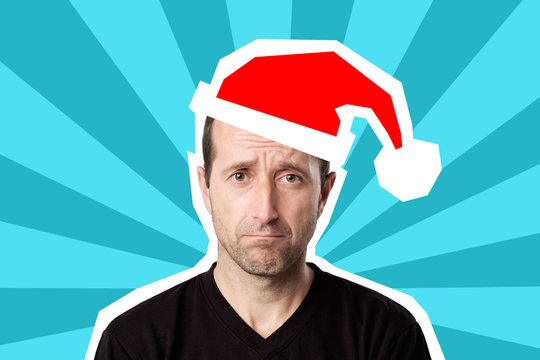 Portrait Of A Mature Sad Man In Christmas Cap On Bright Blue Pop Art Background. He Is Dissapointed With News. Lost Job