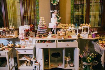 Candy bar with balls, macaroon on candy bar, candy bar on holiday, candy bar at the wedding. Desserts for a party.