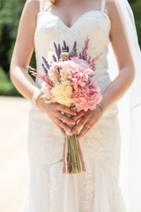 bride holding a bouquet indoor