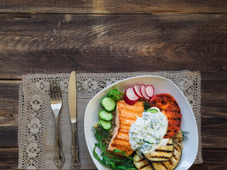 Grilled salmon, eggplants and tomatoes with quinoa and tzatziki sauce