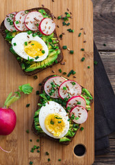 Toasts with avocado, eggs, radish and green onion