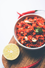 Hot and spicy Hot chilli chutney using lal mirch, cumin seeds, lemon juice and coriander. served in a bowl. selective focus