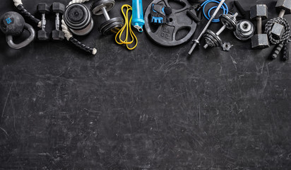 Sports equipment on a black background. Top view. Motivation