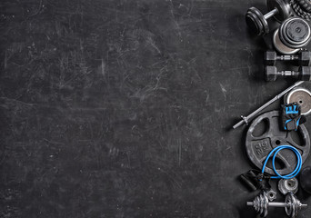 Sports equipment on a black background. Top view. Motivation