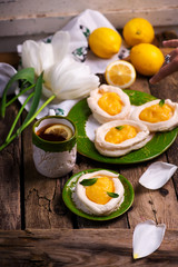 egg shaped meringue nests with lemon curd.traditional easter pastries.