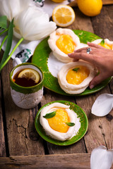 egg shaped meringue nests with lemon curd.traditional easter pastries.