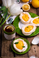 egg shaped meringue nests with lemon curd.traditional easter pastries.