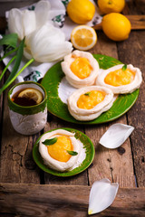 egg shaped meringue nests with lemon curd.traditional easter pastries.