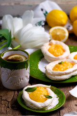 egg shaped meringue nests with lemon curd.traditional easter pastries.