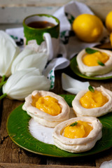 egg shaped meringue nests with lemon curd.traditional easter pastries.