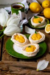 egg shaped meringue nests with lemon curd.traditional easter pastries.