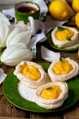egg shaped meringue nests with lemon curd.traditional easter pastries.
