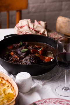 Beef cheeks in red wine with carrots and potato gratin.