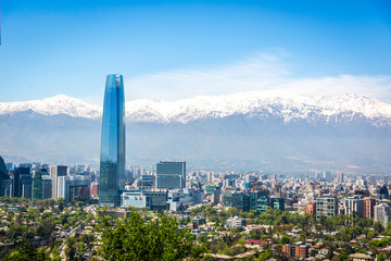 Amazing aerial view of Santiago city with the Andes range covered in snow in the background in Chile