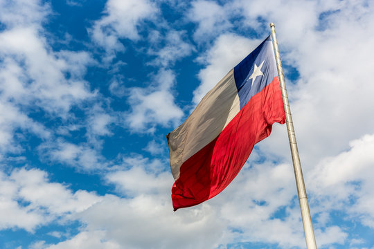 The flag of Chile in Santiago in a blue sky day