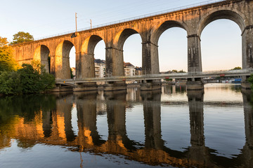 Fototapeta premium Bridge.Banks of the Mayenne river, City of Laval, Mayenne, Pays de Loire, France. August 5, 2018