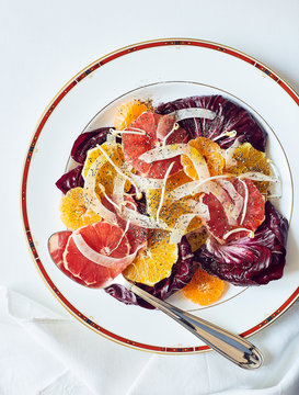 agrumes and fennel appetizer salad on white decorated dish