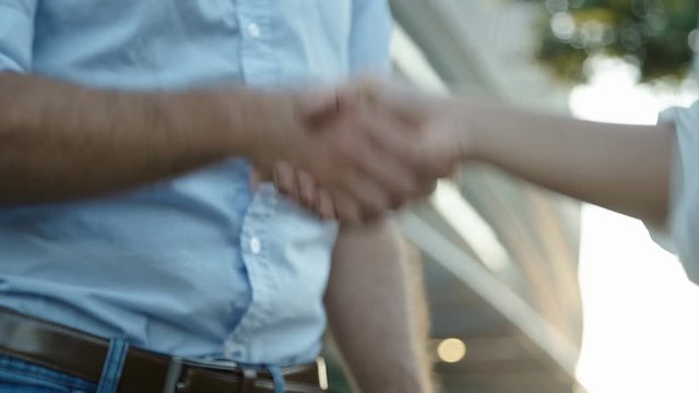 Footage of three people shaking hands. Two interviewers and one applicant shaking hands consecutively. Slow motion. Teamwork concept.