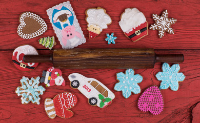 Christmas gingerbread cookies  on a red wooden rustic table