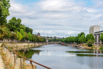 Fototapeta na wymiar Banks of the Mayenne river, City of Laval, Mayenne, Pays de Loire, France. August 5, 2018