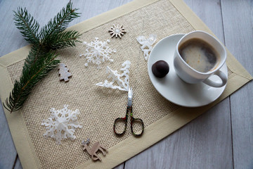 New Year gingerbread cookies and a cup of coffee on a white background