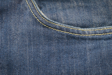 Fototapeta premium closeup front pocket on blue denim jeans and button