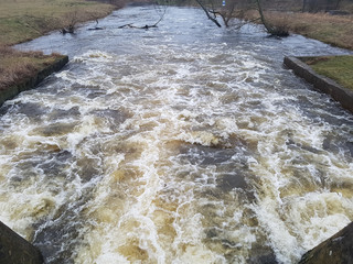 water flowing over dam