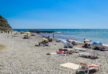 People resting on beach of resort the Black Sea Coast of Divnomorskoe town. Krasnodar region, Russia