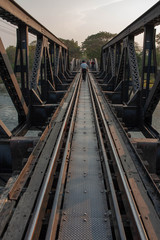 Fototapeta na wymiar Old railway bridge in Thailand, railway bridge over the river