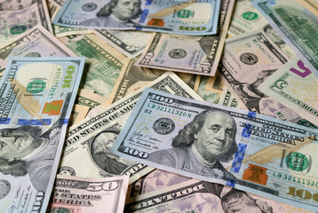 Fototapeta na wymiar Closed up heap of United States one hundred dollar ($100) bills 