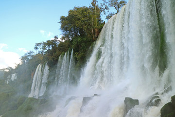 Awesome low angle view of Iguazu Falls at Argentinian side, UNESCO World Heritage in Puerto Iguazu,...