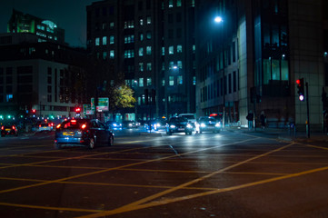 Tower hill road london at night having cars and other traffic