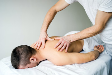 Obraz na płótnie Canvas Young Man Receiving Sport Massage 